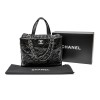 CHANEL bag in black patent leather and flap in gray tweed.