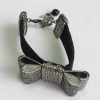 Bracelet CHANEL ruban strass en métal argenté et ruban gros grain noir