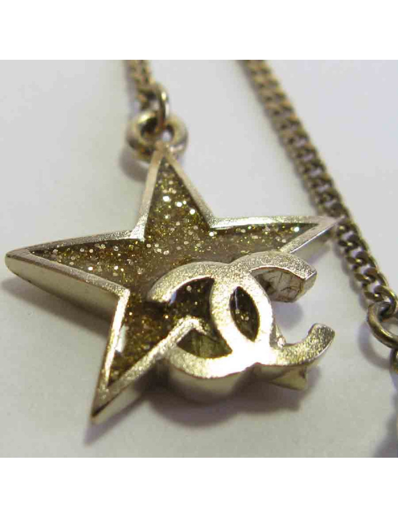 Boucles d'oreille clous CHANEL pendantes étoile et lune en métal doré