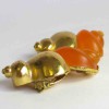 Boucles d'oreille clips CHRISTIAN DIOR vintage en métal doré et plexi orange