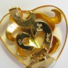 Boucles d'oreille clips coeur YSL YVES SAINT LAURENT dorées et transparentes