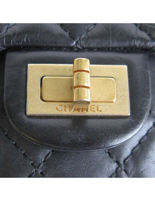 CHANEL Clutch in aged black quilted leather