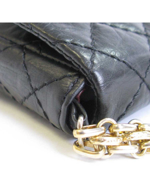 CHANEL Clutch in aged black quilted leather