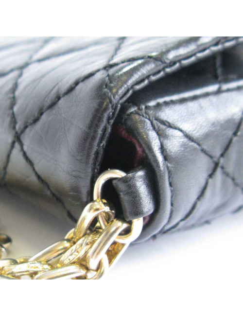 CHANEL Clutch in aged black quilted leather
