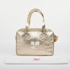 COURREGES bag in golden smooth lambskin leather