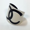 CHANEL CC black and white plastic cuff bracelet 