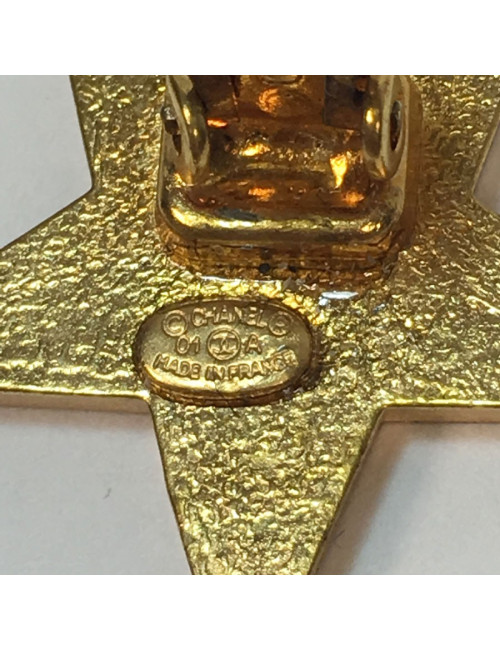 CHANEL star clip-on earrings in gilt metal and ivory resin
