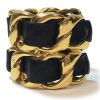 CHANEL Collector cuff bracelet in gilt metal and black leather