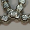 Broche CHANEL CC perles et métal argenté