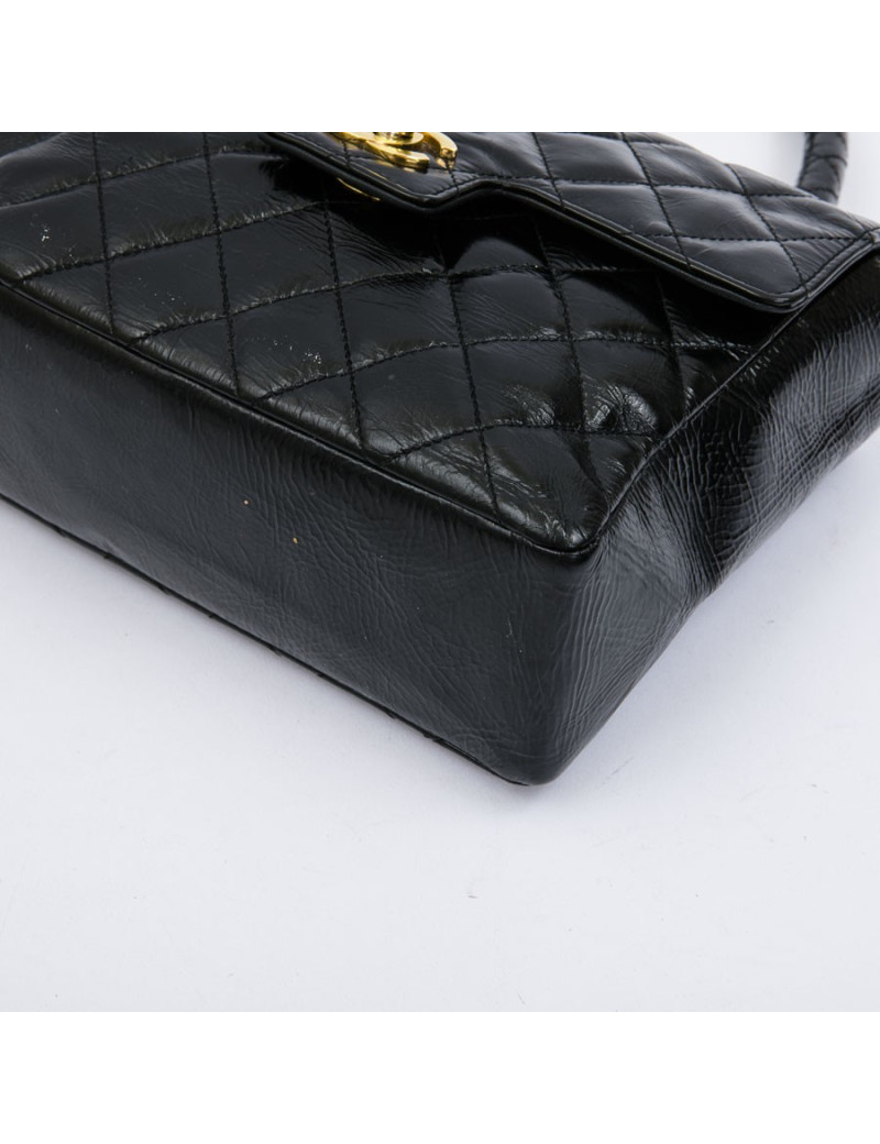 CHANEL mini bag in quilted semi-gloss black leather