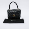 CHANEL mini bag in quilted semi-gloss black leather