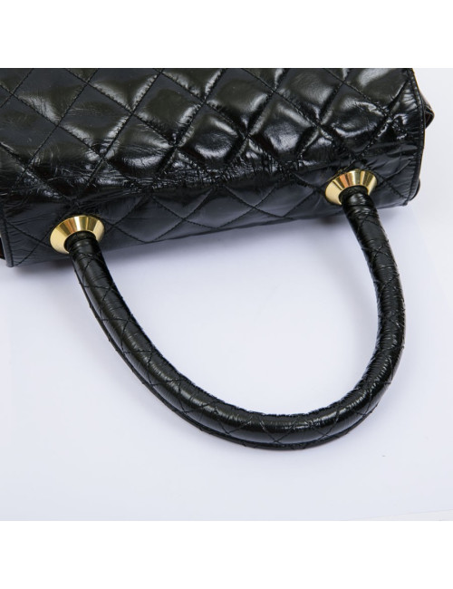 CHANEL mini bag in quilted semi-gloss black leather