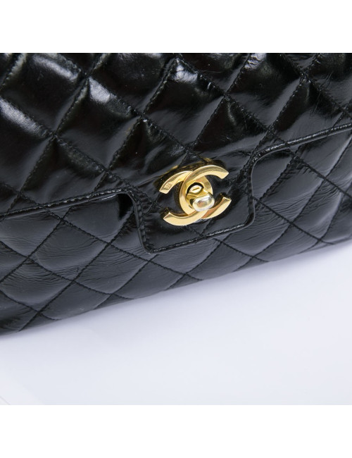 CHANEL mini bag in quilted semi-gloss black leather