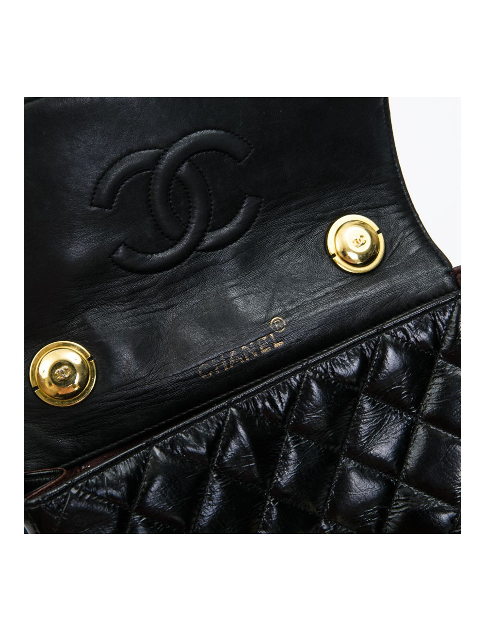 CHANEL mini bag in quilted semi-gloss black leather