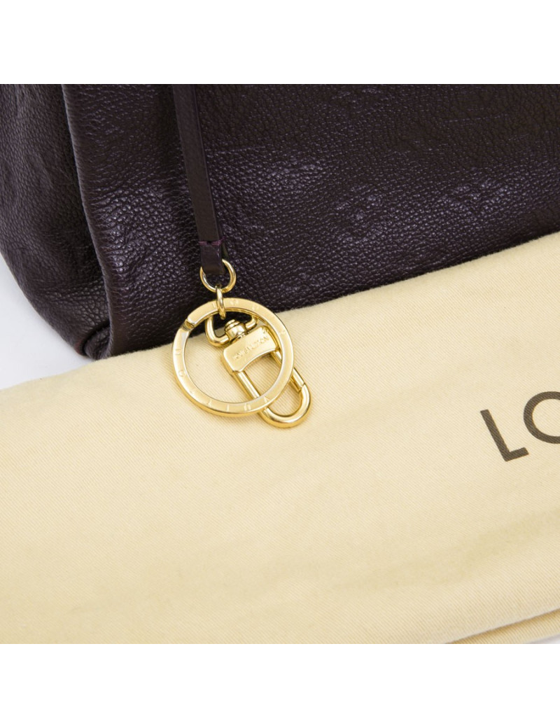 LOUIS VUITTON Artsy bag in grape empreinte embossed monogram leather