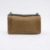 CHANEL Boy bag in gold color grained leather