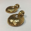 YSL YVES SAINT LAURENT vintage clip-on earrings in hammered gilded metal