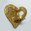 Boucles d'oreilles clips CHRISTIAN LACROIX coeur en métal doré or mat