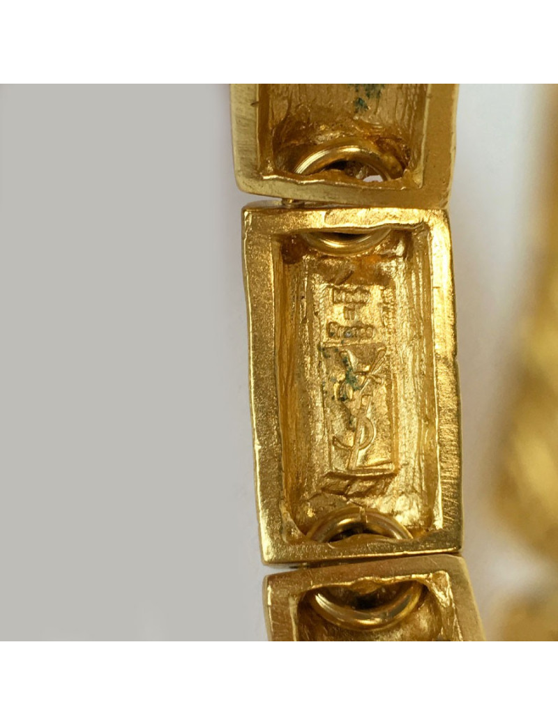 YVES SAINT LAURENT rigid bracelet in gilt metal