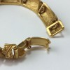 YVES SAINT LAURENT rigid bracelet in gilt metal