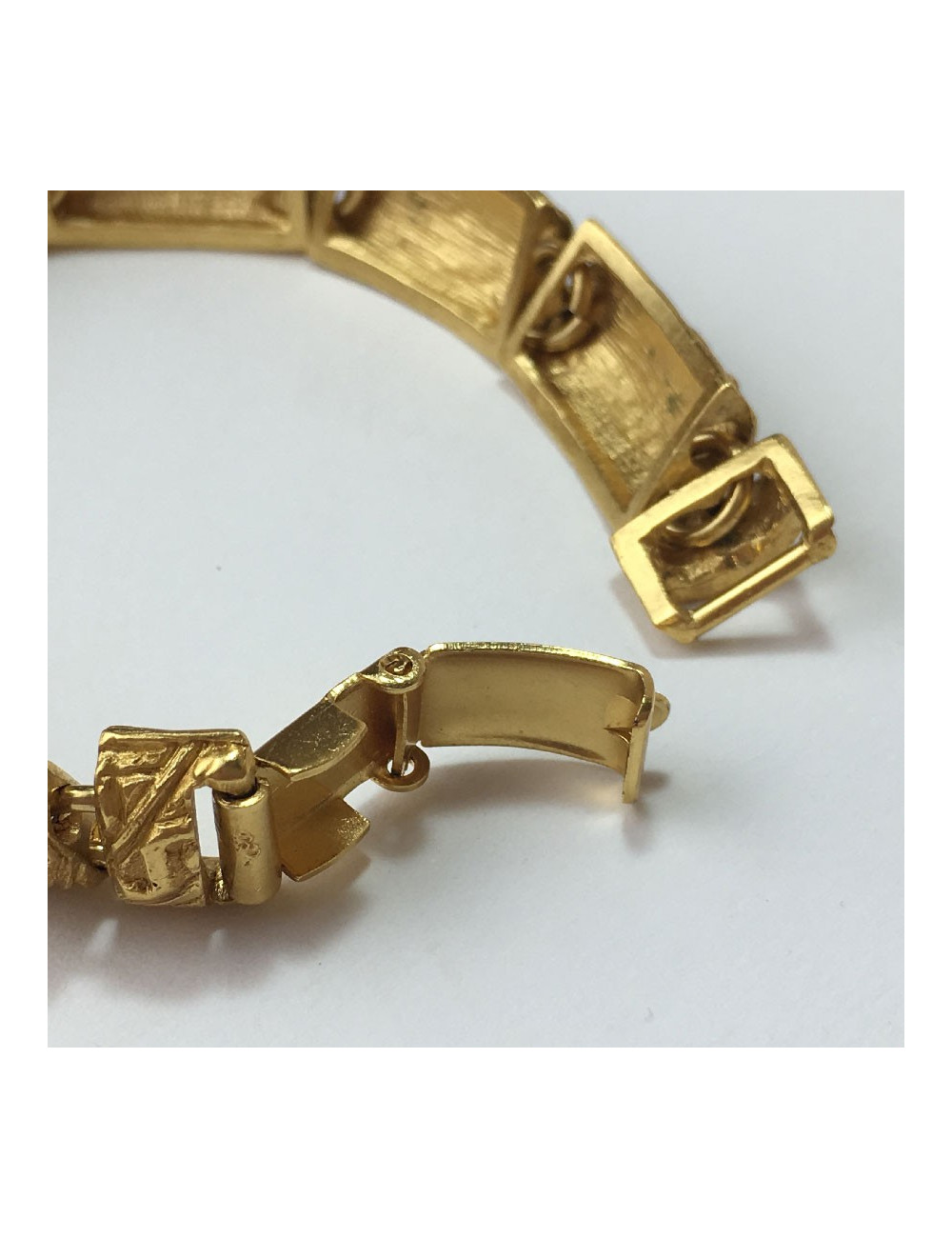 YVES SAINT LAURENT rigid bracelet in gilt metal