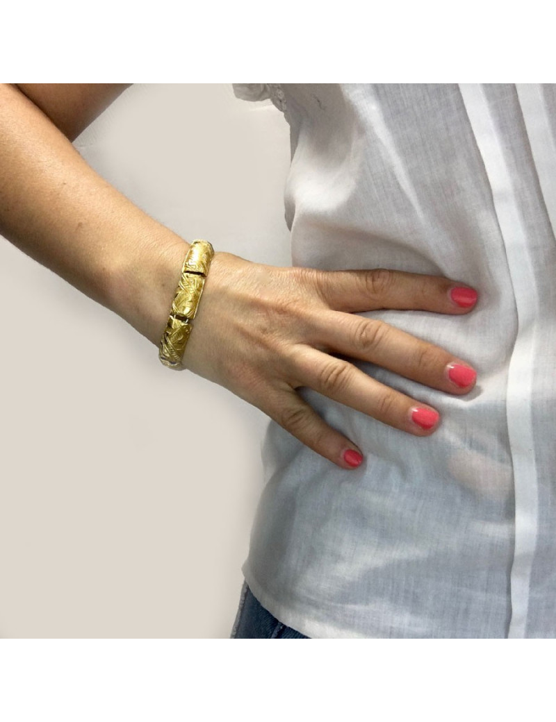 YVES SAINT LAURENT rigid bracelet in gilt metal