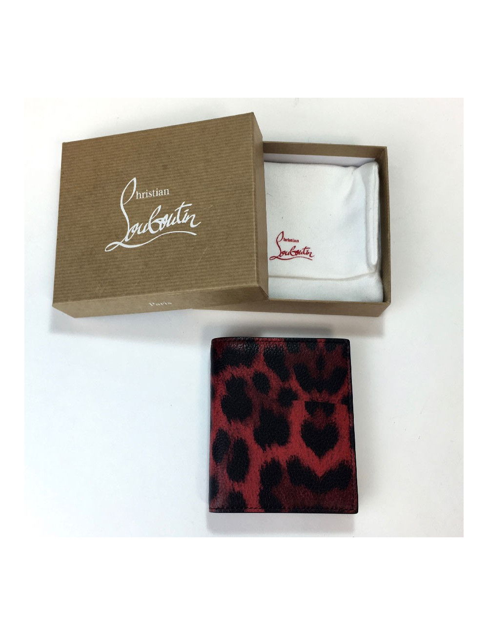Portefeuille CHRISTIAN LOUBOUTIN en cuir rouge motif léopard