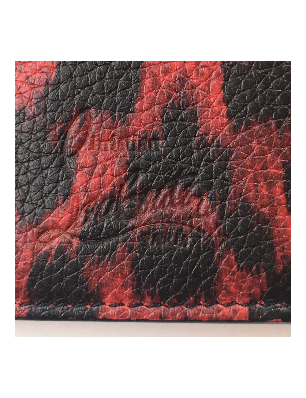 Portefeuille CHRISTIAN LOUBOUTIN en cuir rouge motif léopard