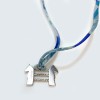 Collier-bracelet HERMES lien en soie multicolore et pendentif argenté
