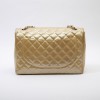 CHANEL maxi jumbo bag in gold quilted leather