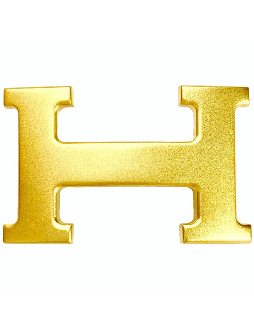 Boucle H HERMES en métal doré mat