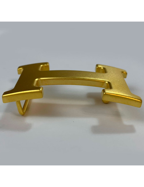 Boucle H HERMES en métal doré mat