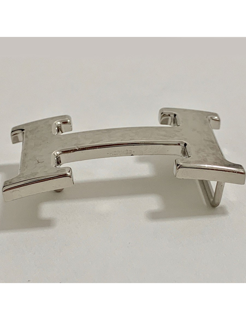 Boucle H HERMES en métal argenté martelé