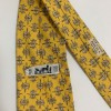 Cravate HERMES jaune en soie motif fers à cheval