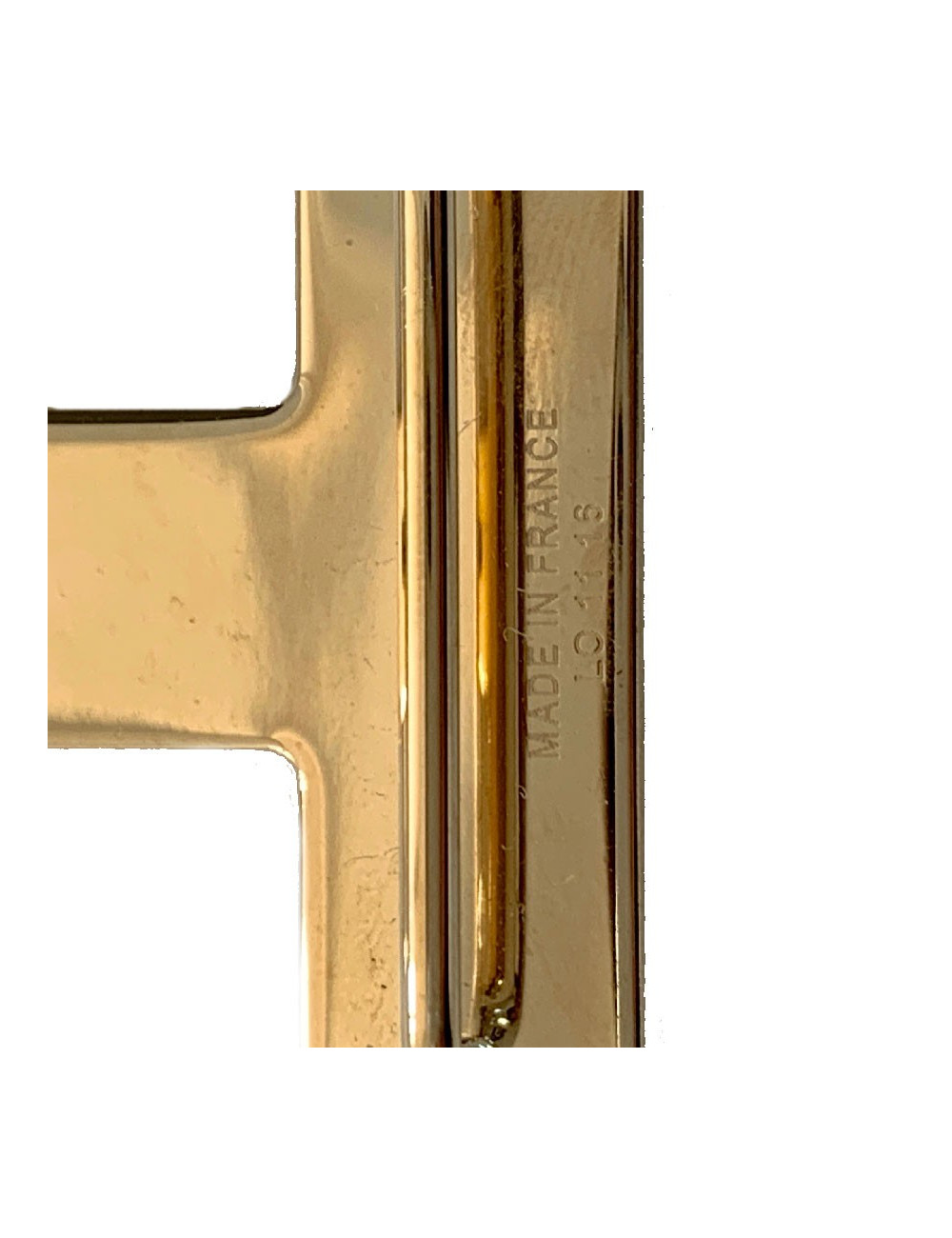 Boucle H HERMES métal doré mat