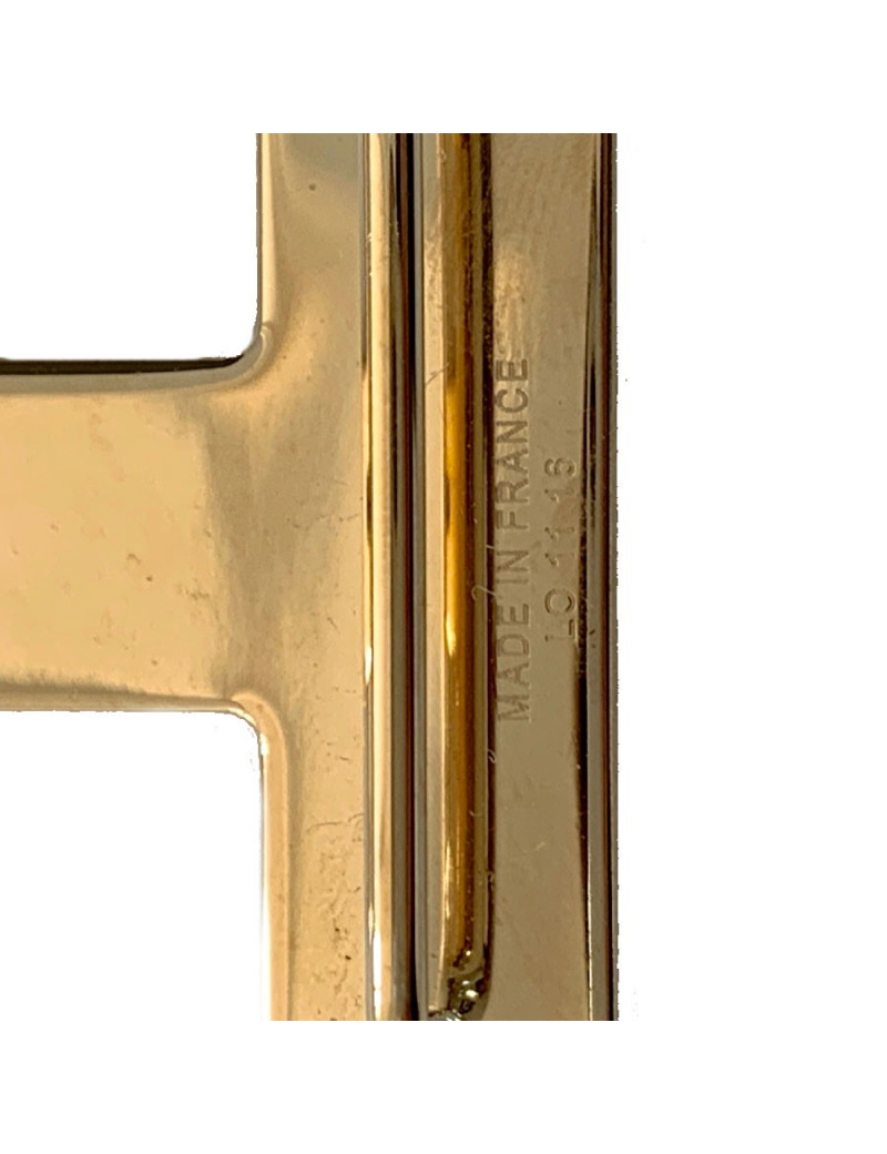 Boucle H HERMES métal doré mat