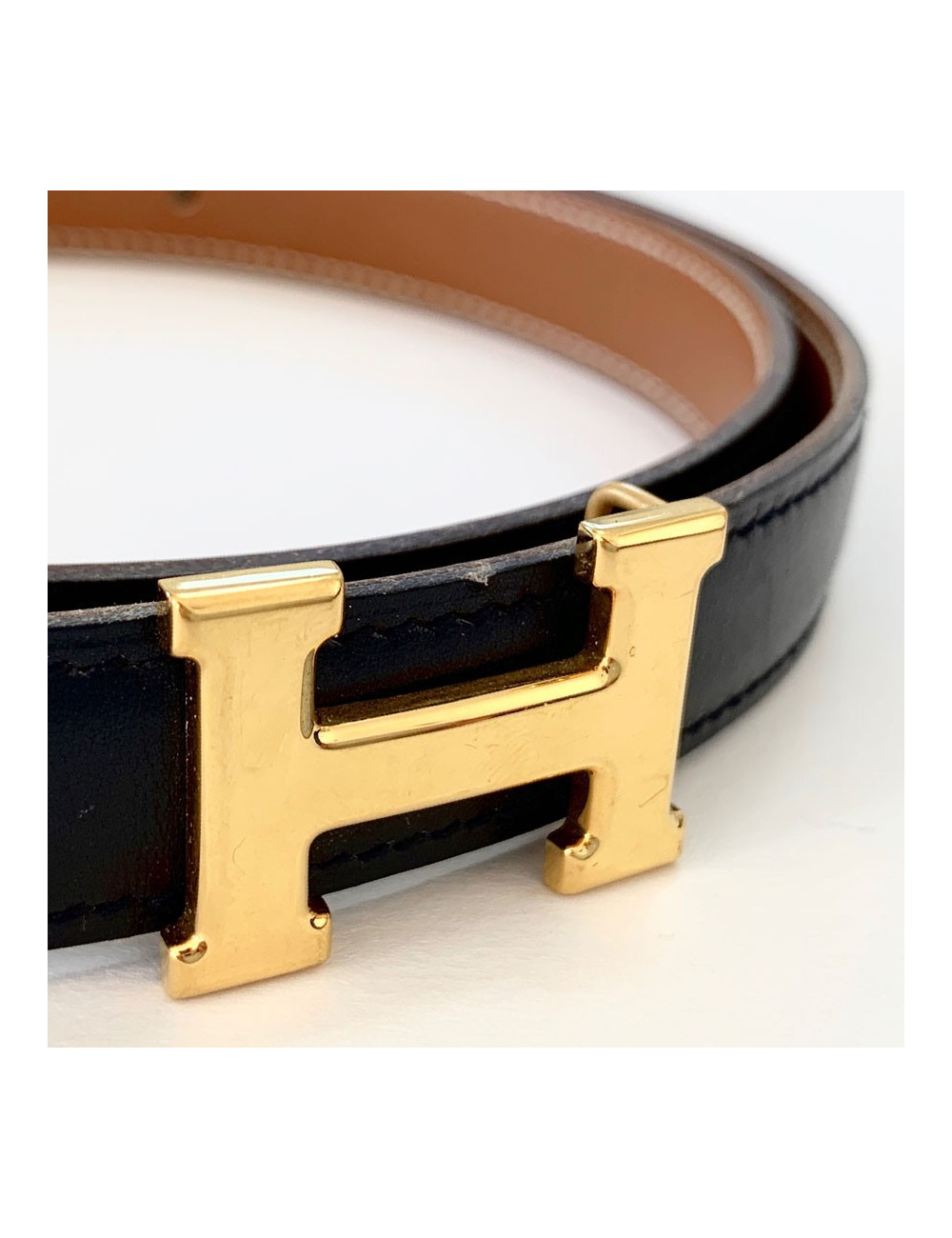 Ceinture H HERMES cuir noir et boucle dorée