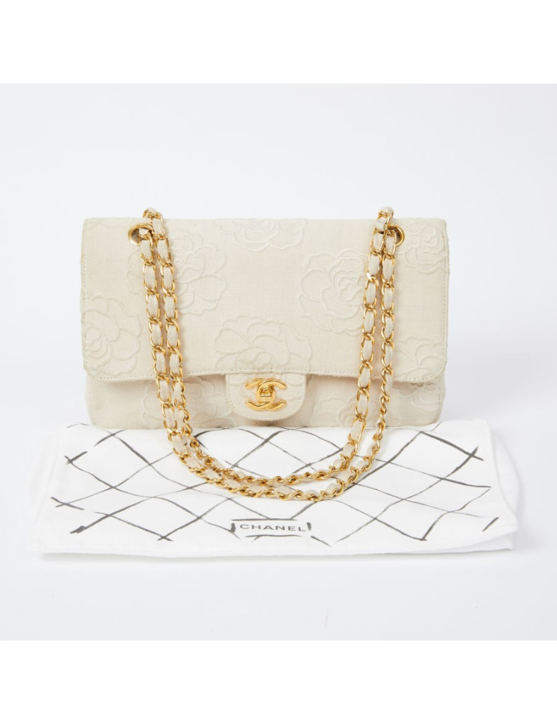A NETTOYERSac motifs camélias CHANEL toile beige