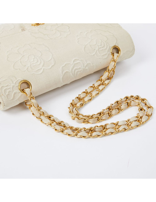 A NETTOYERSac motifs camélias CHANEL toile beige