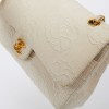 A NETTOYERSac motifs camélias CHANEL toile beige