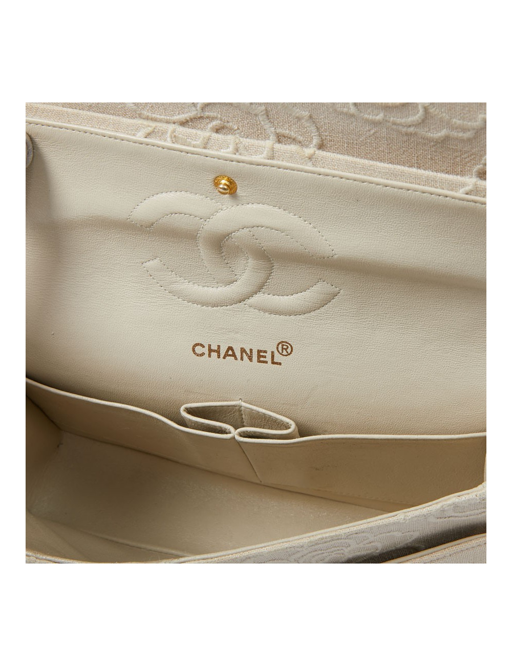 A NETTOYERSac motifs camélias CHANEL toile beige