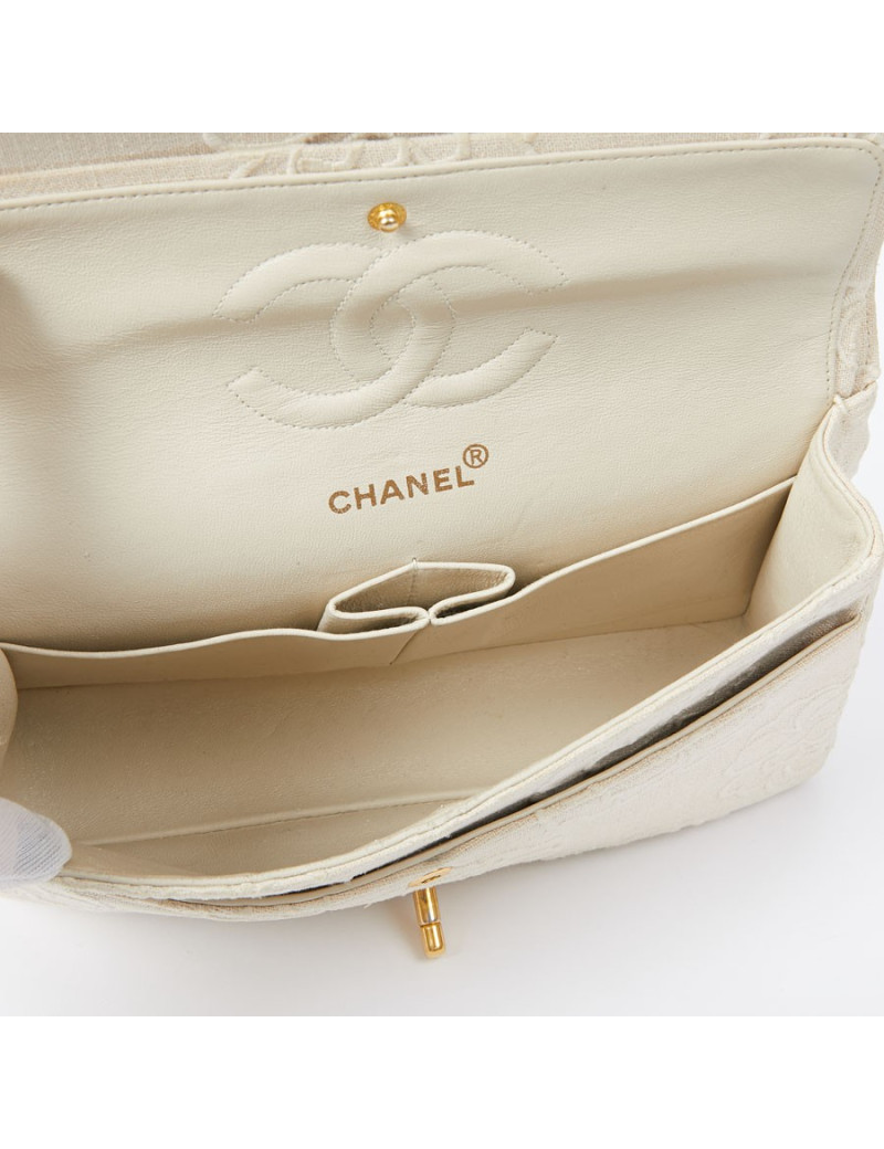 A NETTOYERSac motifs camélias CHANEL toile beige