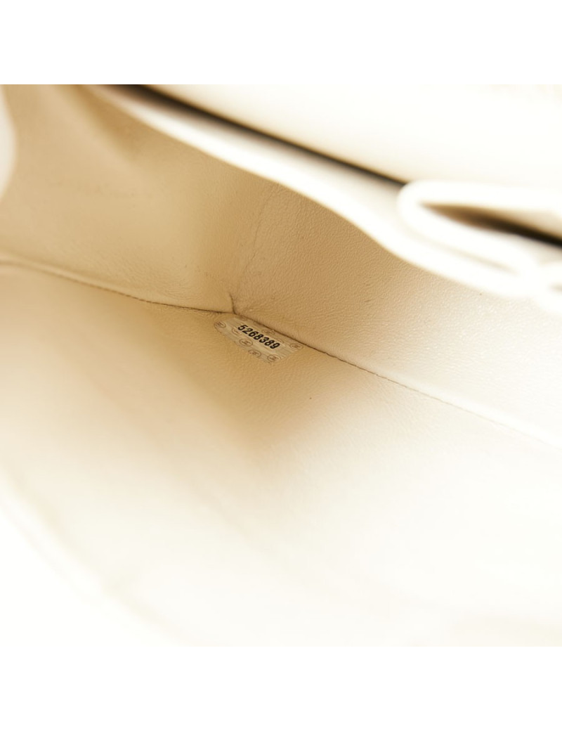 A NETTOYERSac motifs camélias CHANEL toile beige