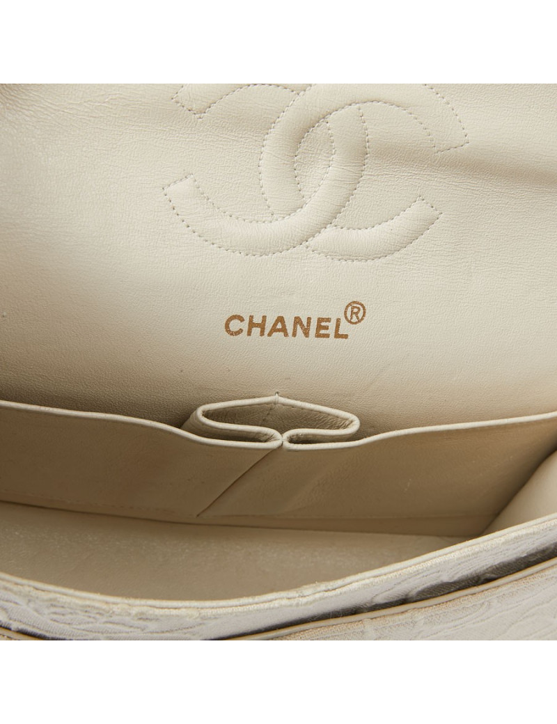 A NETTOYERSac motifs camélias CHANEL toile beige