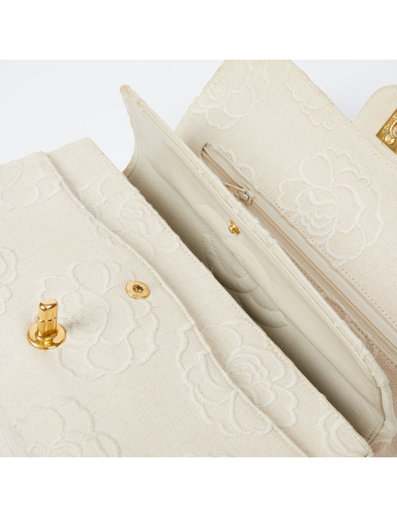 A NETTOYERSac motifs camélias CHANEL toile beige