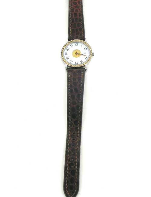 Montre HERMES sellier vintage en or et crocodile marron