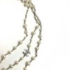 Sautoir Chanel perles blanches et noeud en strass