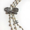 Sautoir Chanel perles et strass noeud papillon