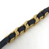 CHANEL Bracelet chaîne dorée entrelacé de cuir noir