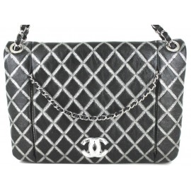 CHANEL bag in quilted black leather and silver sequins